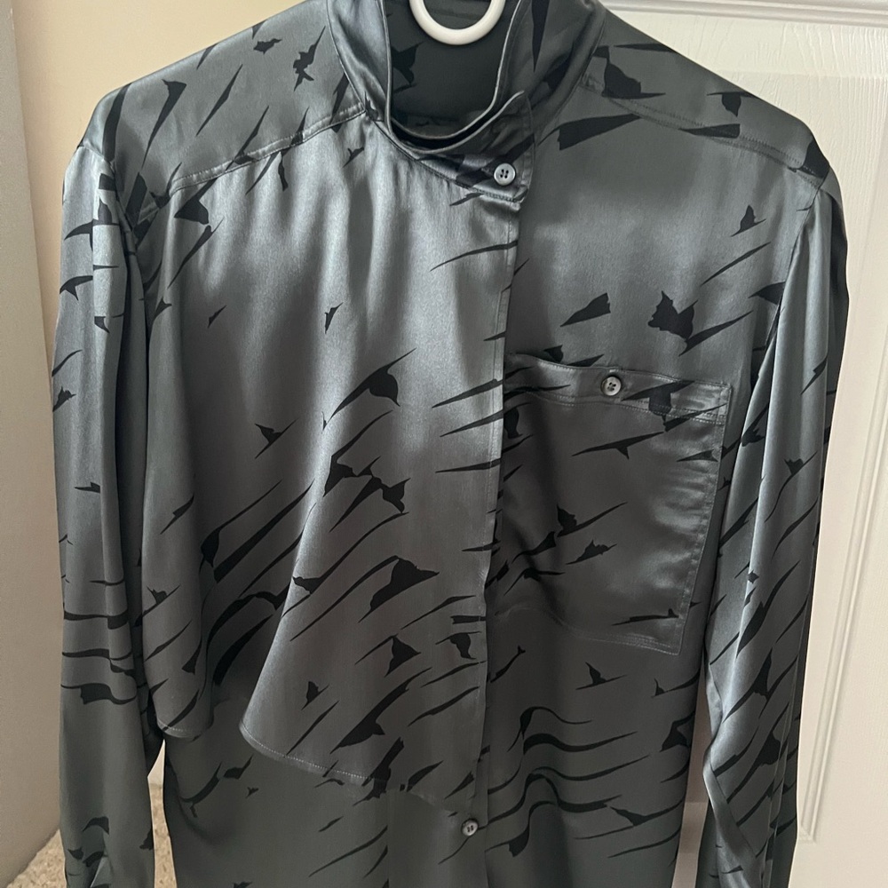 Beautiful Escada silk blouse with a scarf like detailing.